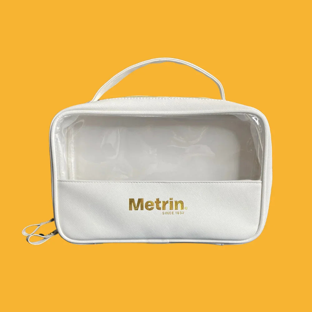 White toiletry bag with 'Metrin' branding on a yellow background