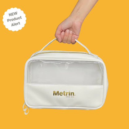 White toiletry bag with 'Metrin' branding on a yellow background