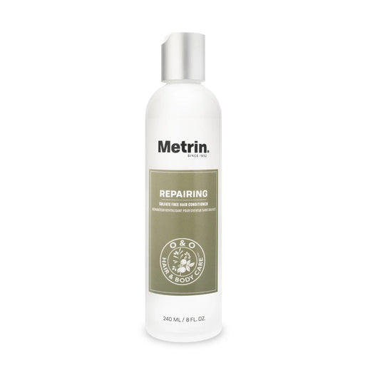 Bottle of Metrin repairing conditioner on a white background